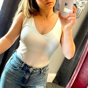 New small white soft bodysuit with cute back